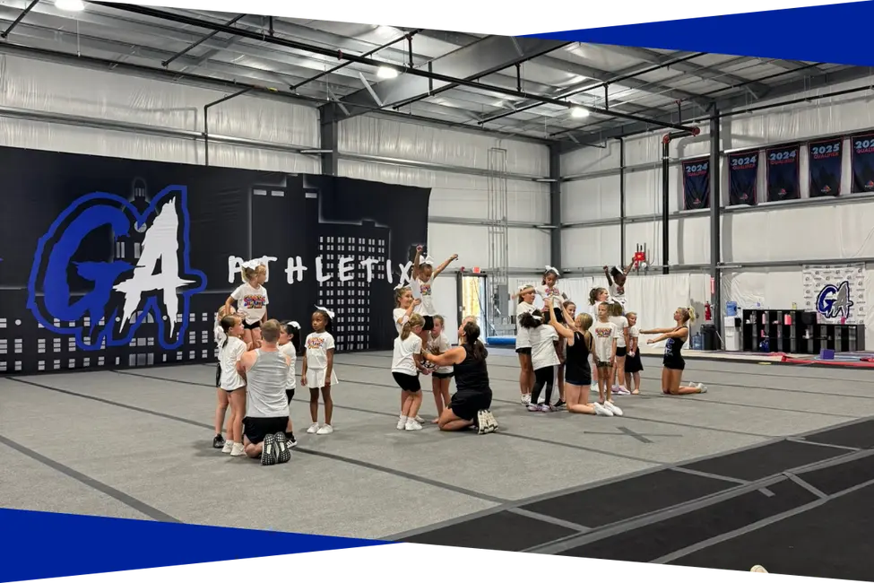 Recreational cheer class practicing stunt groups at Genesis Athletix in Fort Wayne