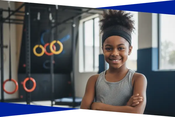 Confident young NinjaZone athlete standing in the Genesis Athletix training area