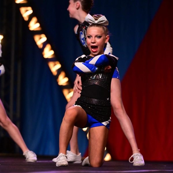 Young athletes learning cheer motions in a recreational cheer class