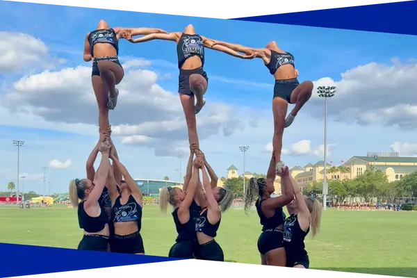Genesis Athletix cheer team performing a synchronized group stunt sequence