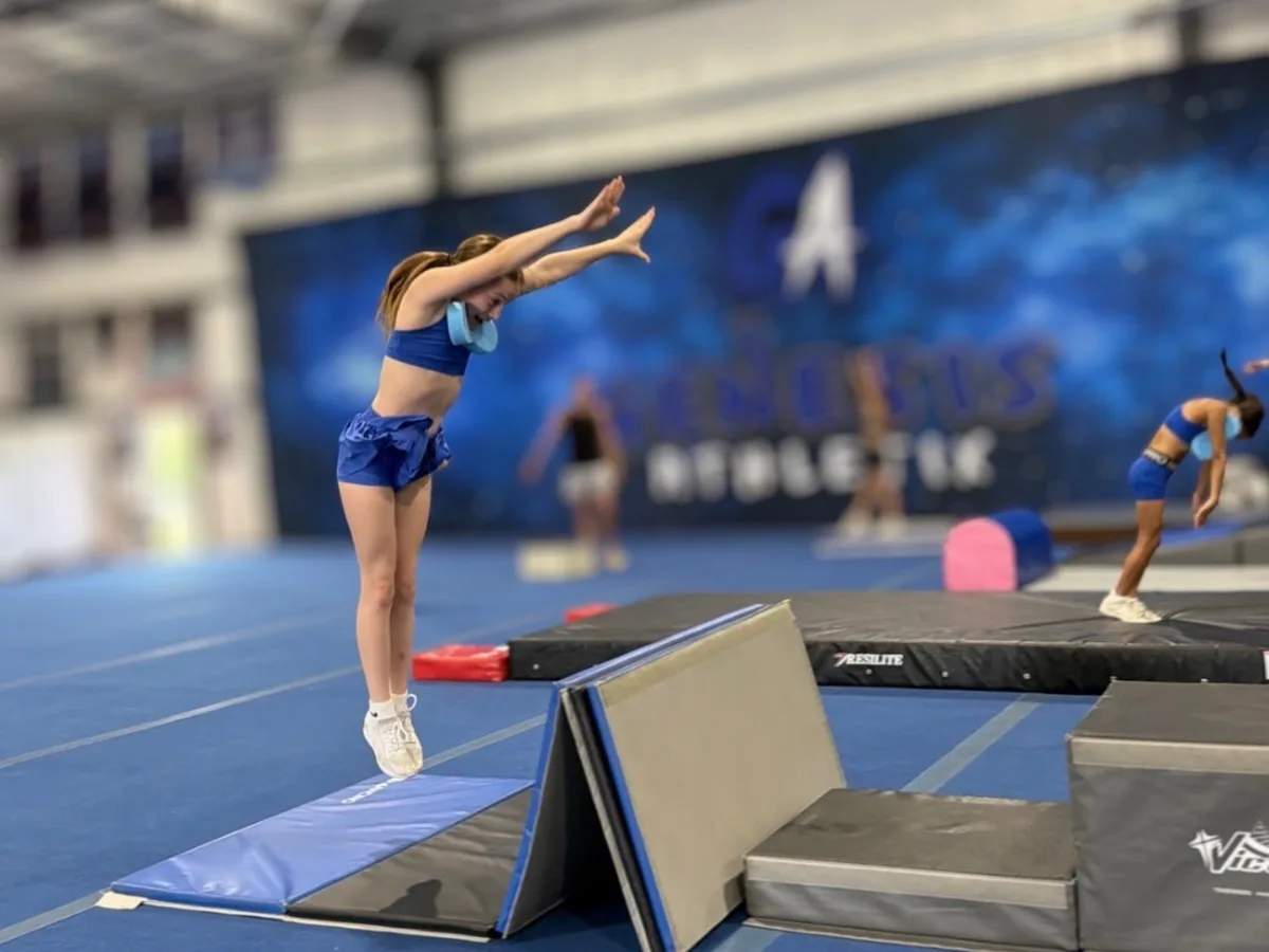 Young athlete practicing a tumbling skill in the gym at Genesis Athletix